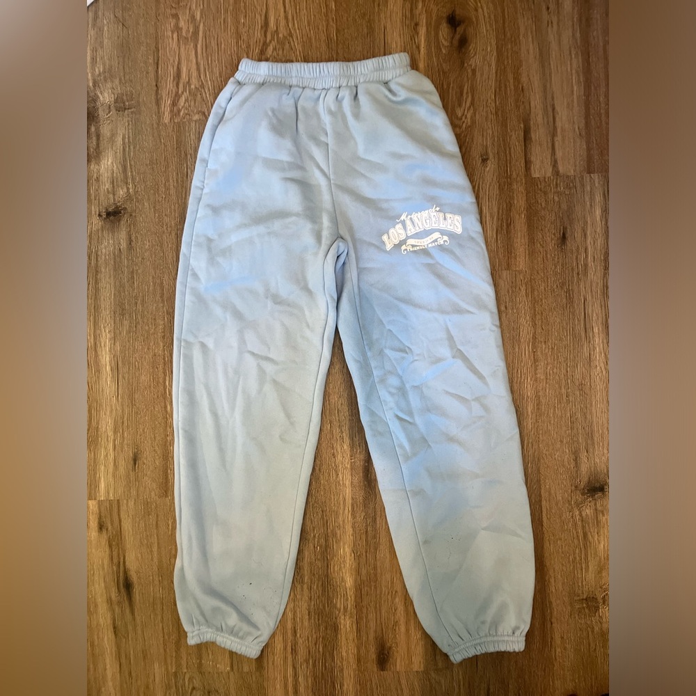 Blue sweatpants.
